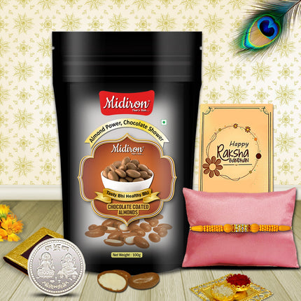 Designer Rakhi in a premium hamper with chocolate almonds (90g), silver coin, roli-chawal, and Raksha Bandhan message card.