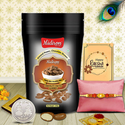 Rakhi kit featuring festival-themed treats with chocolate almonds, silver coin, designer Rakhi, and greeting card.