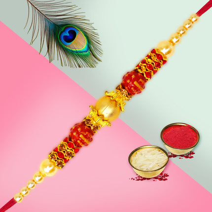 Elegant Rakhi thread adorned with colorful beads and golden highlights, exuding festive beauty.