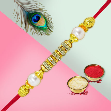  gold rakhi with pearls 