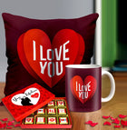 Valentine gift set featuring premium chocolates, a romantic printed mug, and a soft cushion – perfect for expressing love to your partner.