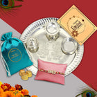 Basket-style Rakhi kit with thali, colored powders, festive Rakhi, and greeting card for brother