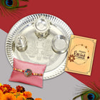 Rakhi gift set featuring a designer rakhi, chocolates pouch (90g), greeting card, analog wrist watch, Roli-Chawal, and a decorative display with brother-themed design — perfect for Raksha Bandhan gifting