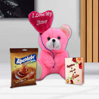 Pink teddy bear with a heart-shaped balloon and Alpenliebe Gold chocolate 