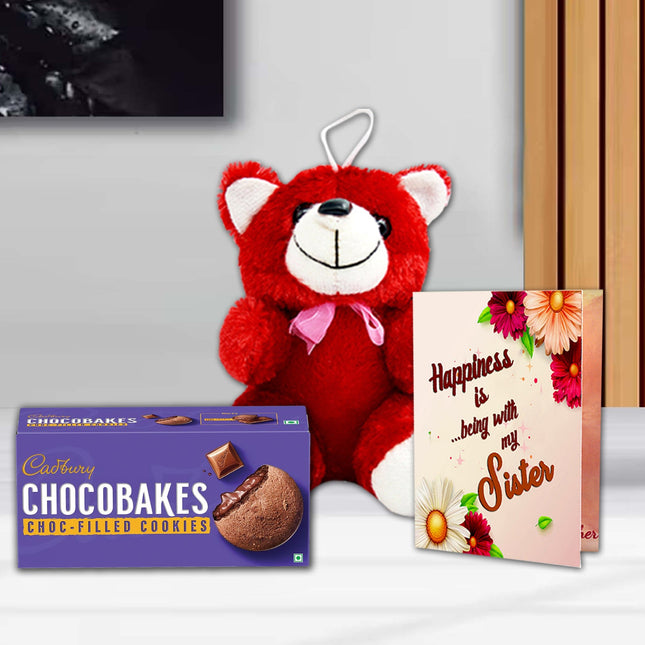Red teddy bear, Cadbury Chocobakes cookies, and a card with floral design 