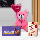 Pink teddy bear with 'I Love My Sister' heart, Cadbury Chocobakes cookies, and a card