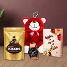 Red teddy bear, Kisses chocolate, watch, and a card 